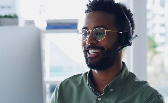 Smiling application support personnel with a headset