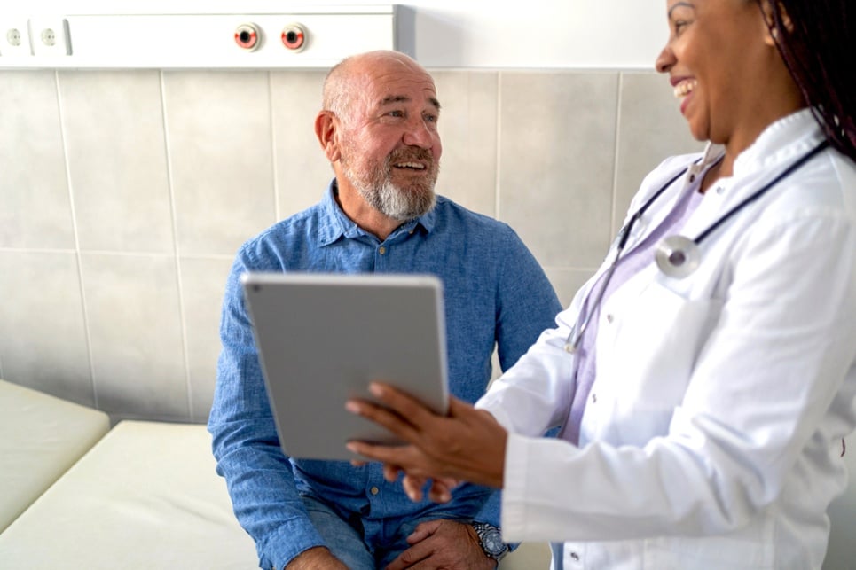 Doctor and patient viewing tablet