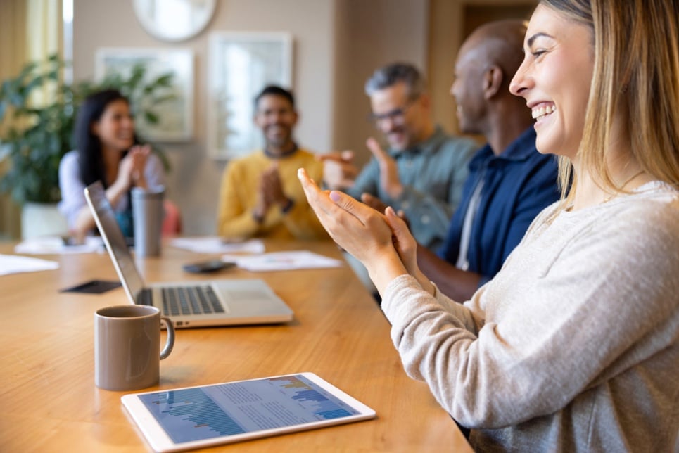 Team celebrating during meeting